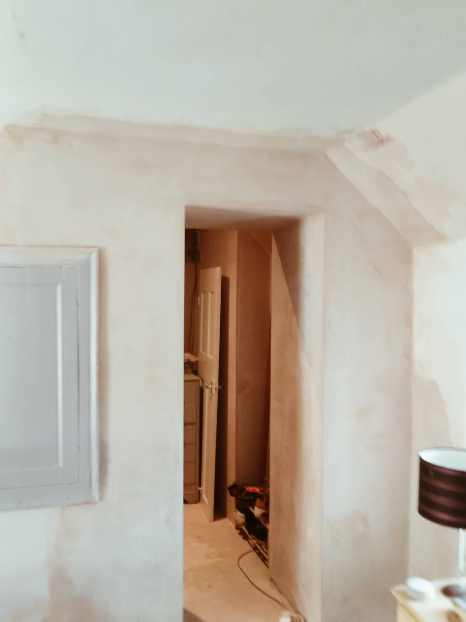 Freshly plastered hallway doorway ready for painting