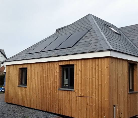 New roof with slate tiles and solar panels